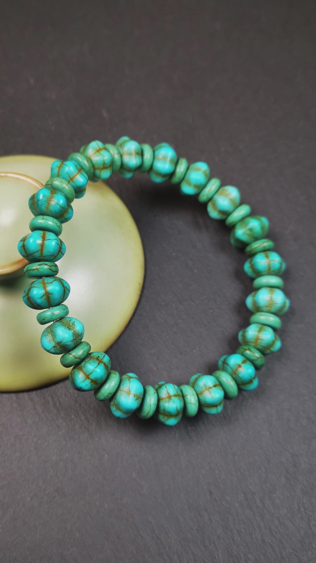 This beautiful turquoise bracelet is handmade from Tibet in 1980's. It's green color, made of turquoise, 19 hexagon beads and 19 spacer beads in total,7.4 inches circumference,0.47 width.