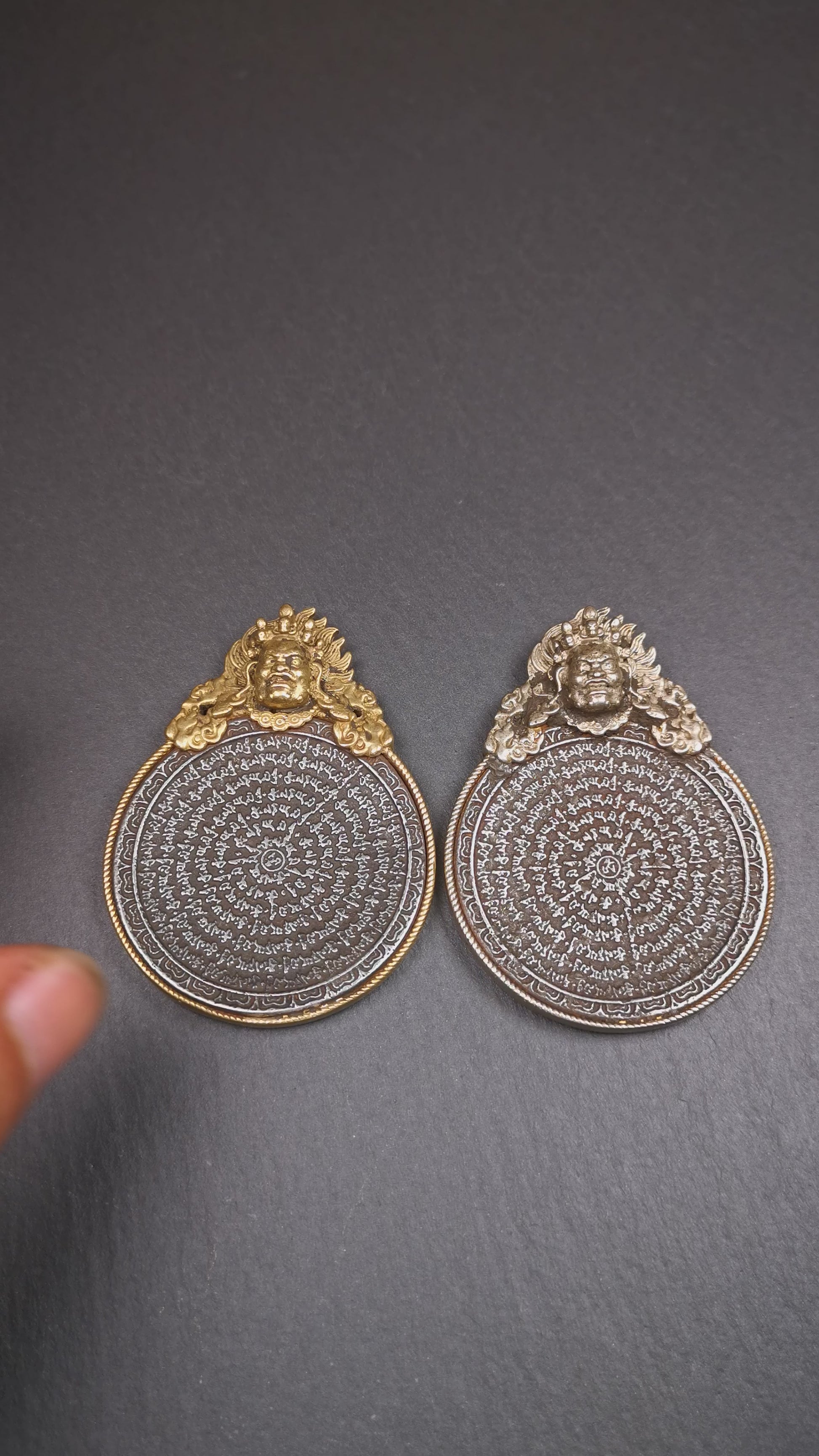 This type of tibetan mantra badge amulet was made by Tibetan craftsmen and come from Hepo Town, Baiyu County, Tibet.It is made of cold iron,grey color,carved mantra of Om Mani Padme Hum  It adopts a split casting method, the shell is Mahakala.