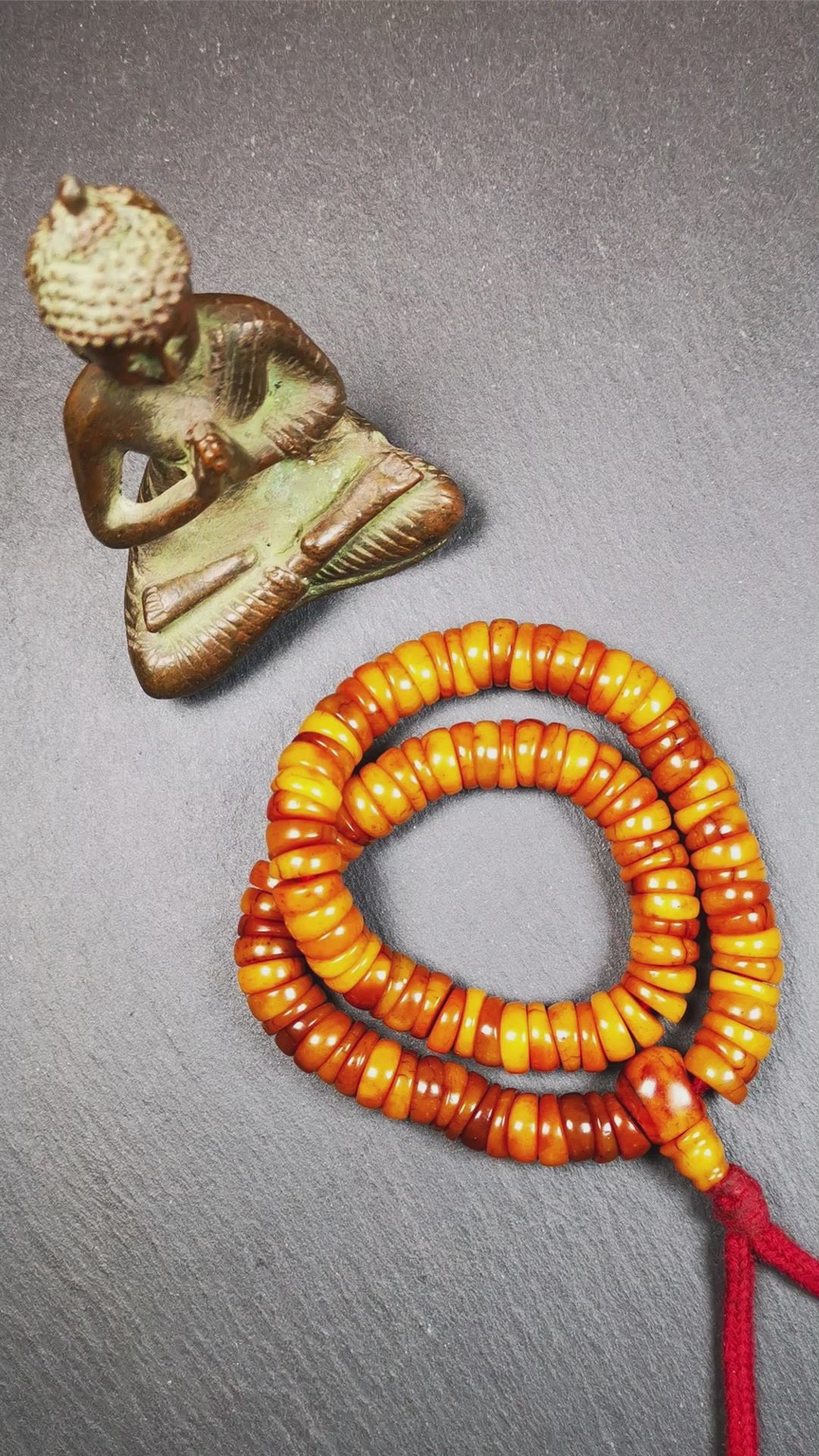 This bone carved mala beads is made by Tibetan,about 30 years Old. It has 108 wave shape beads,1 guru bead,all hand carved with tibetan yak bone. It reflects the original ascetic state of the original ecology, very simple and full of sense of time