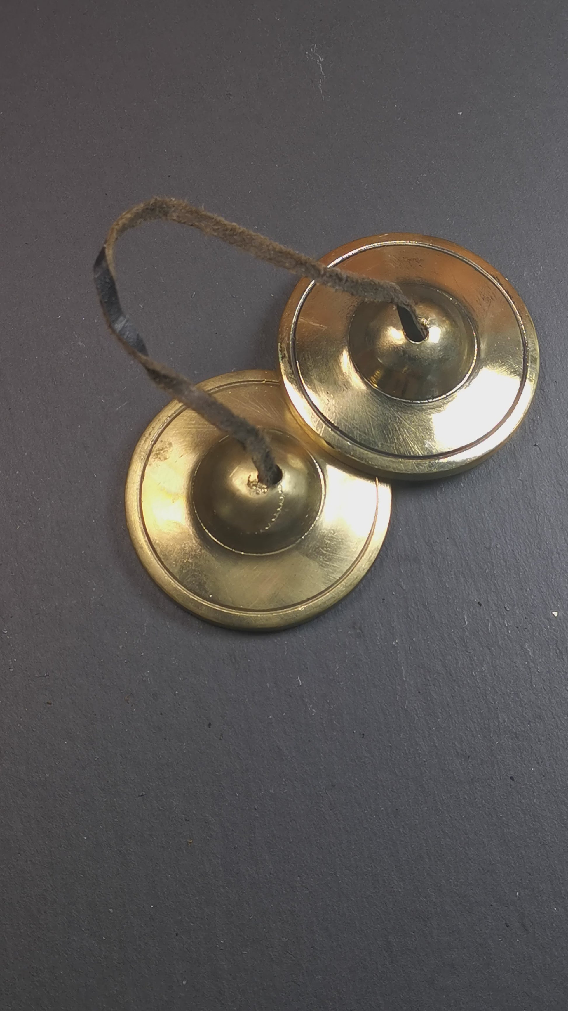 This tingsha bell set was handmade in Nepal,using traditional techniques and materials. It was made of brass,6.5cm diameter,shiny color,with pure, clear and resonant,good for meditation. Come with tingsha case.