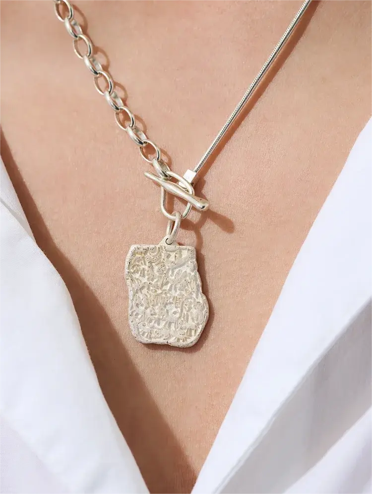 "Emotions like stones, never erode." Couples necklace - Gandhanra-ART