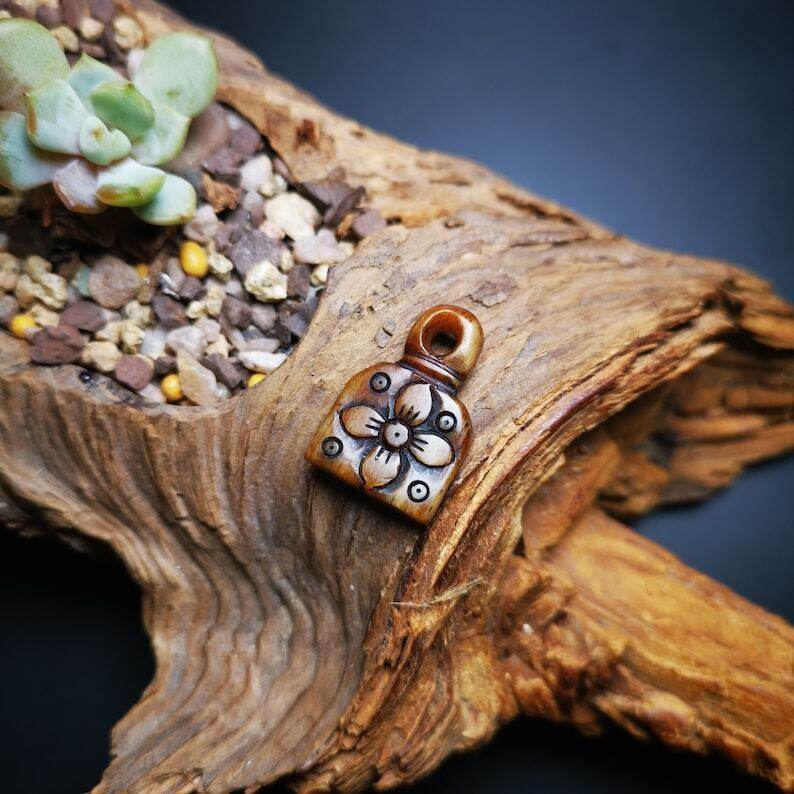 Yak Bone Carved Flower Prayer Bead Pendant - Tibetan Buddhist art, close-up detail