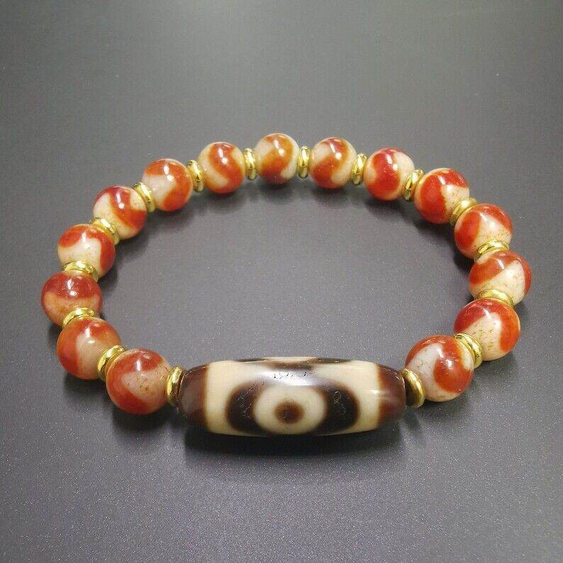 Fire Agate Dzi Bead Bracelet - Tibetan Buddhist mala beads, detailed view