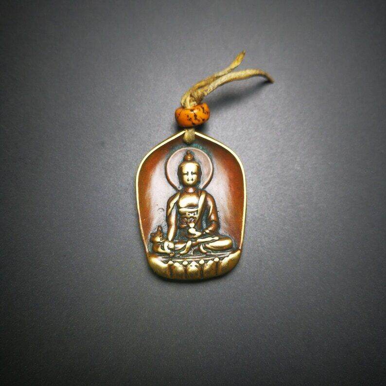 Buddhist Protective Pendant,Shakyamuni Gautama Amulet - Tibetan Buddhist amulet, close-up detail