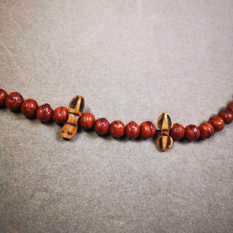 Yak Bone Carved Amulet Vajra and Kila Dorje Phurba Pendant - Tibetan Buddhist amulet, detailed view