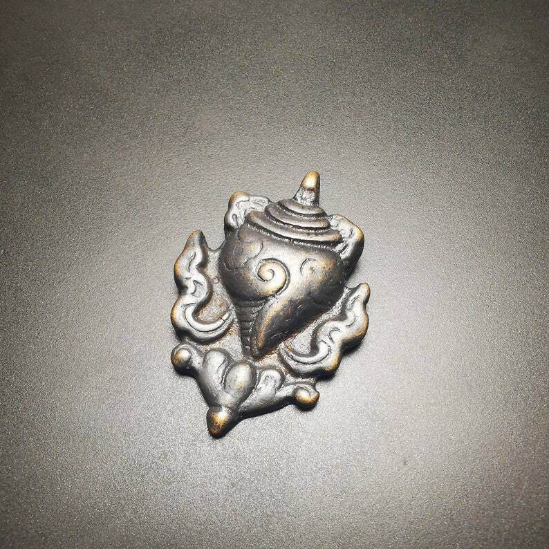 Shankha,Divine Conch Badge,Tibetan Buddhist Amulet Pendant - Tibetan Buddhist amulet, close-up detail