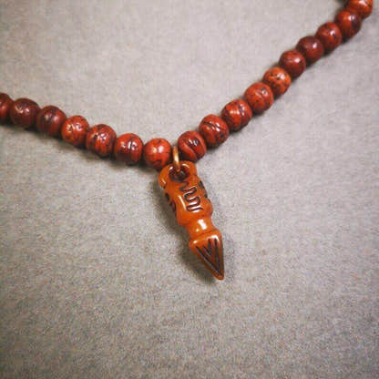 Yak Bone Carved Skull Phurba Amulet, Ritual Implement Pendant - Tibetan Buddhist amulet, detailed view