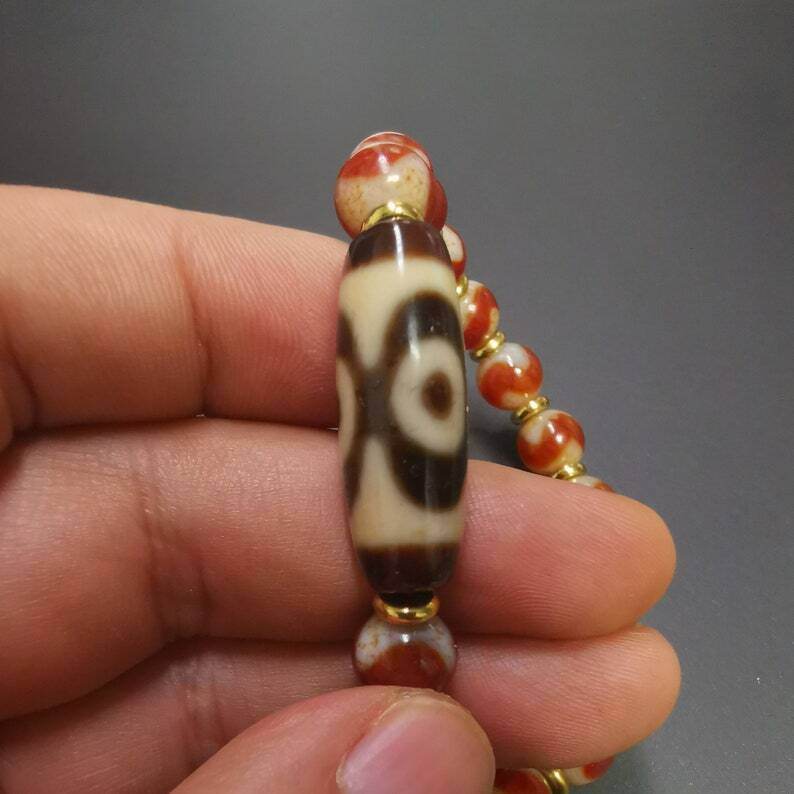 Fire Agate Dzi Bead Bracelet - Tibetan Buddhist mala beads, close-up detail