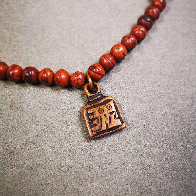 Yak Bone Carved Letter Prayer Bead Pendant - Tibetan Buddhist art, front view