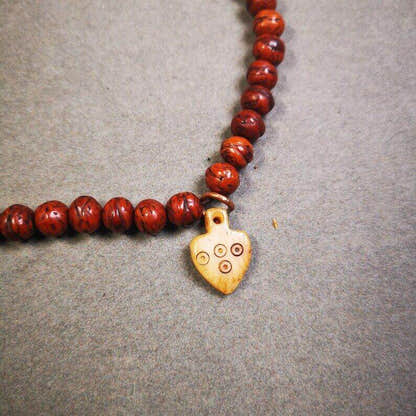 Yak Bone Carved Mantra Dot Prayer Bead Pendant - Tibetan Buddhist art, detailed view