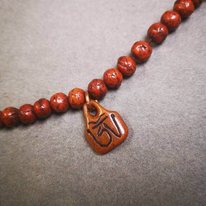 Yak Bone Carved OM Letter Prayer Bead Pendant - Tibetan Buddhist art, detailed view