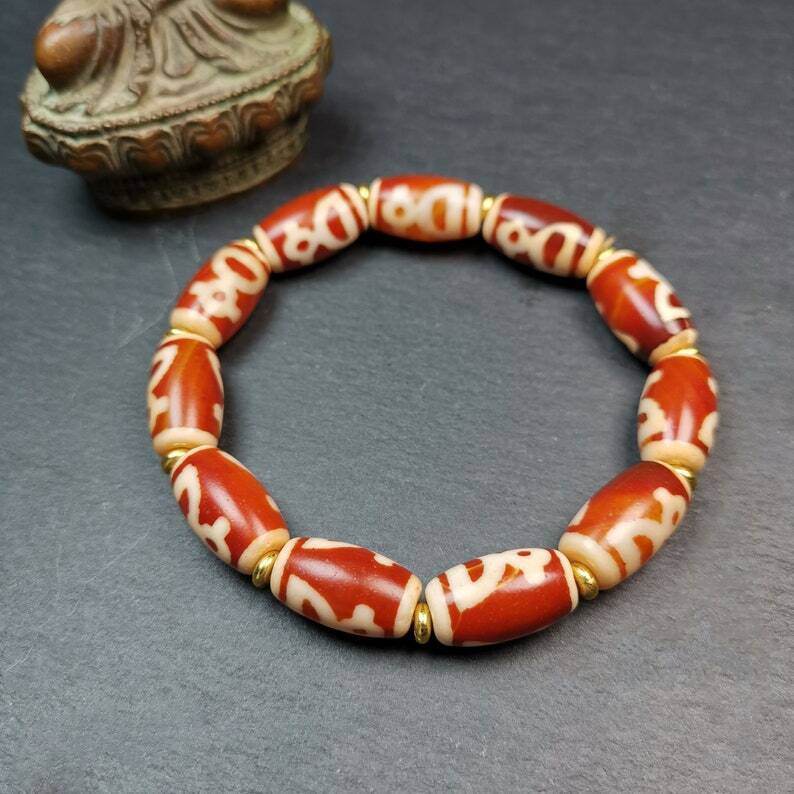 Tibetan Fire Agate Tiger Tooth Dzi Bead Bracelet - Tibetan Buddhist mala beads, detailed view