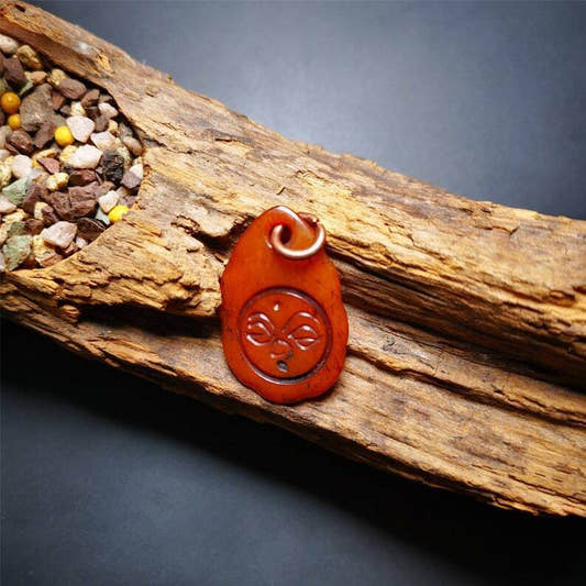 Amulet,Yak Bone Carved Buddha Eye Pendant - Tibetan Buddhist amulet, front view