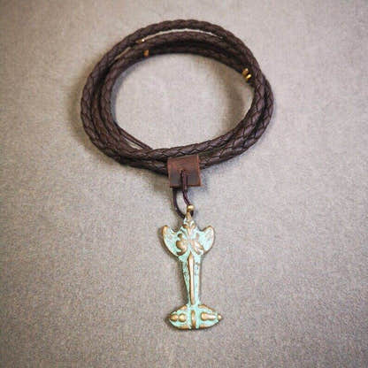 Buddhist Amulet Garuda,Garula,Golden-winged Bird Pendant - Tibetan Buddhist amulet, close-up detail