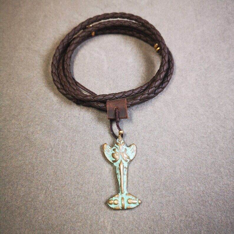 Buddhist Amulet Garuda,Garula,Golden-winged Bird Pendant - Tibetan Buddhist amulet, close-up detail