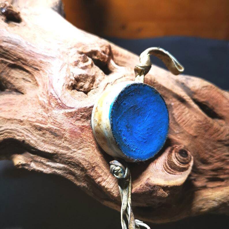 Buddhist Yak Bone Carved Damaru Drum,Mini Chod Drum - Tibetan Buddhist art, close-up detail
