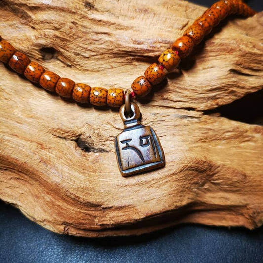 Yak Bone Carved Letter Prayer Bead Pendant - Tibetan Buddhist art, front view