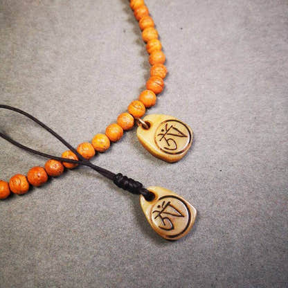 Yak Bone Carved Amulet,Om Pendant for Mala,Bag Hanging - Tibetan Buddhist mala beads, front view