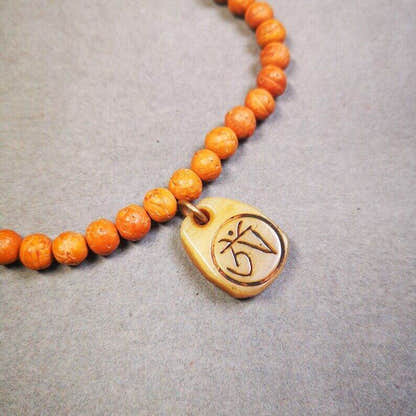 Yak Bone Carved Amulet,Om Pendant for Mala,Bag Hanging - Tibetan Buddhist mala beads, detailed view
