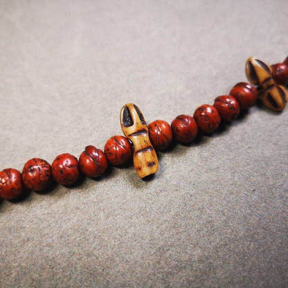 Yak Bone Carved Amulet Vajra and Kila Dorje Phurba Pendant - Tibetan Buddhist amulet, close-up detail