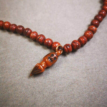 Yak Bone Carved Skull Phurba Amulet, Ritual Implement Pendant - Tibetan Buddhist amulet, close-up detail