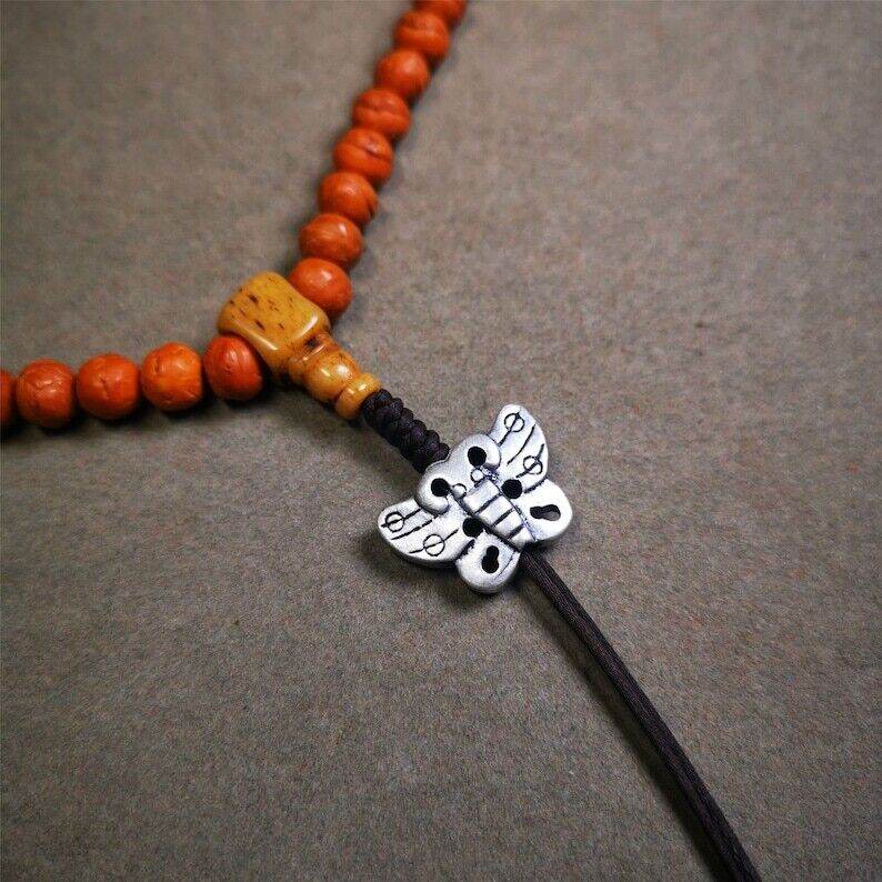 Amulet,Butterfly Pendant for Mala,Bag Hanging,Prayer Bead Necklace - Tibetan Buddhist mala beads, close-up detail