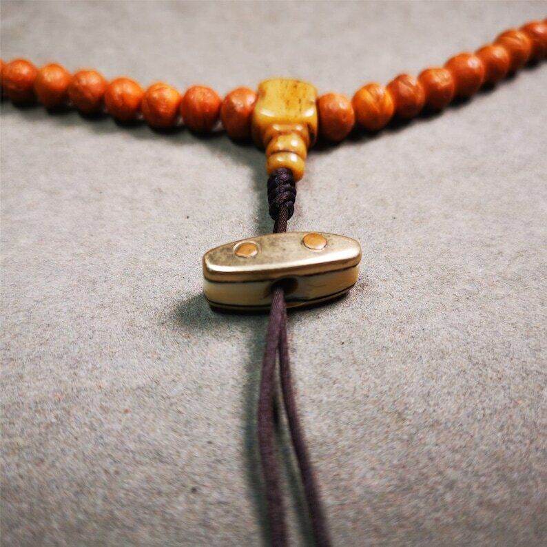 Amulet,Vajra Pendant for Mala,Bag Hanging,Prayer Bead - Tibetan Buddhist mala beads, close-up detail