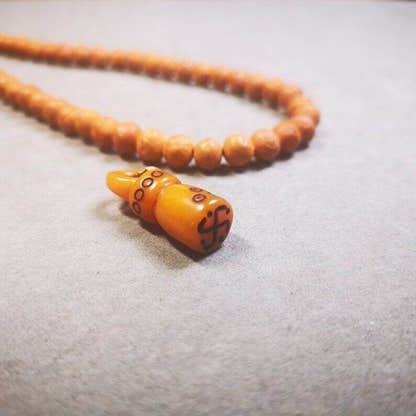 Yak Bone Carved Seal Amulet, Swastika Pattern Stamp Pendant - Tibetan Buddhist amulet, detailed view