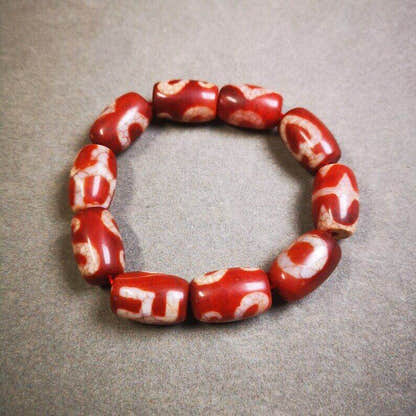 Fire Agate Dzi Bead Bracelet - Tibetan Buddhist mala beads, close-up detail