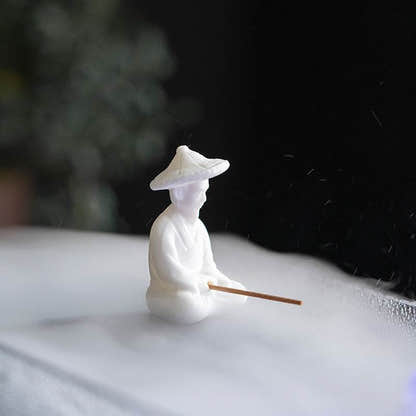 Ceramic Fisherman Incense Holder - Tibetan Buddhist statue, close-up detail