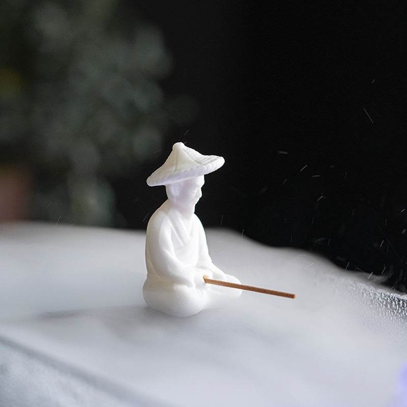 Ceramic Fisherman Incense Holder - Tibetan Buddhist statue, close-up detail