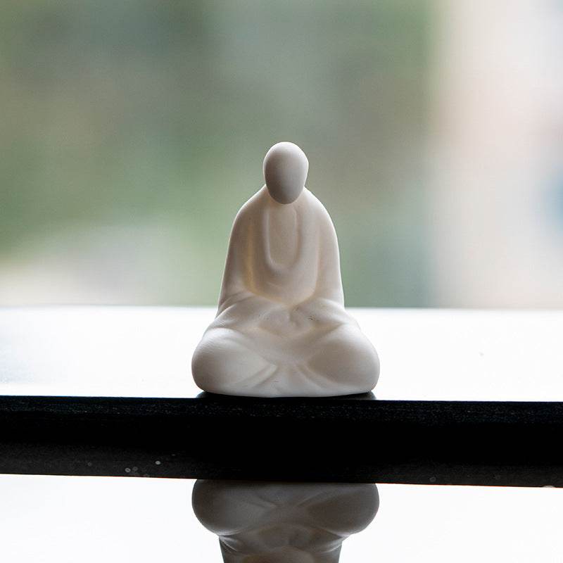 White Porcelain Meditation Buddha Statues - Tibetan Buddhist statue, close-up detail