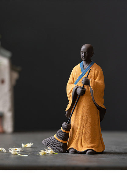 Sweeping Monk Buddha Statue