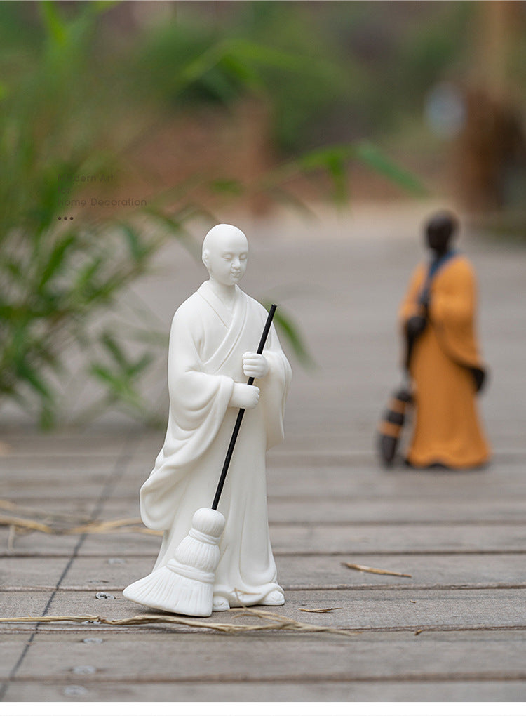 Sweeping Monk Buddha Statue