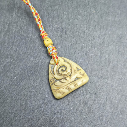 Auspicious Spiral - Eternal Bliss - Hand-carved Tibetan Amulet 32mm - Tibetan Buddhist amulet, front view