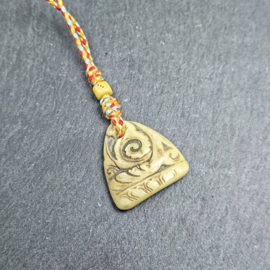 Auspicious Spiral - Eternal Bliss - Hand-carved Tibetan Amulet 32mm - Tibetan Buddhist amulet, front view