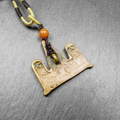 Tibetan Buddhist Amulet - Tibetan Buddhist amulet, detailed view