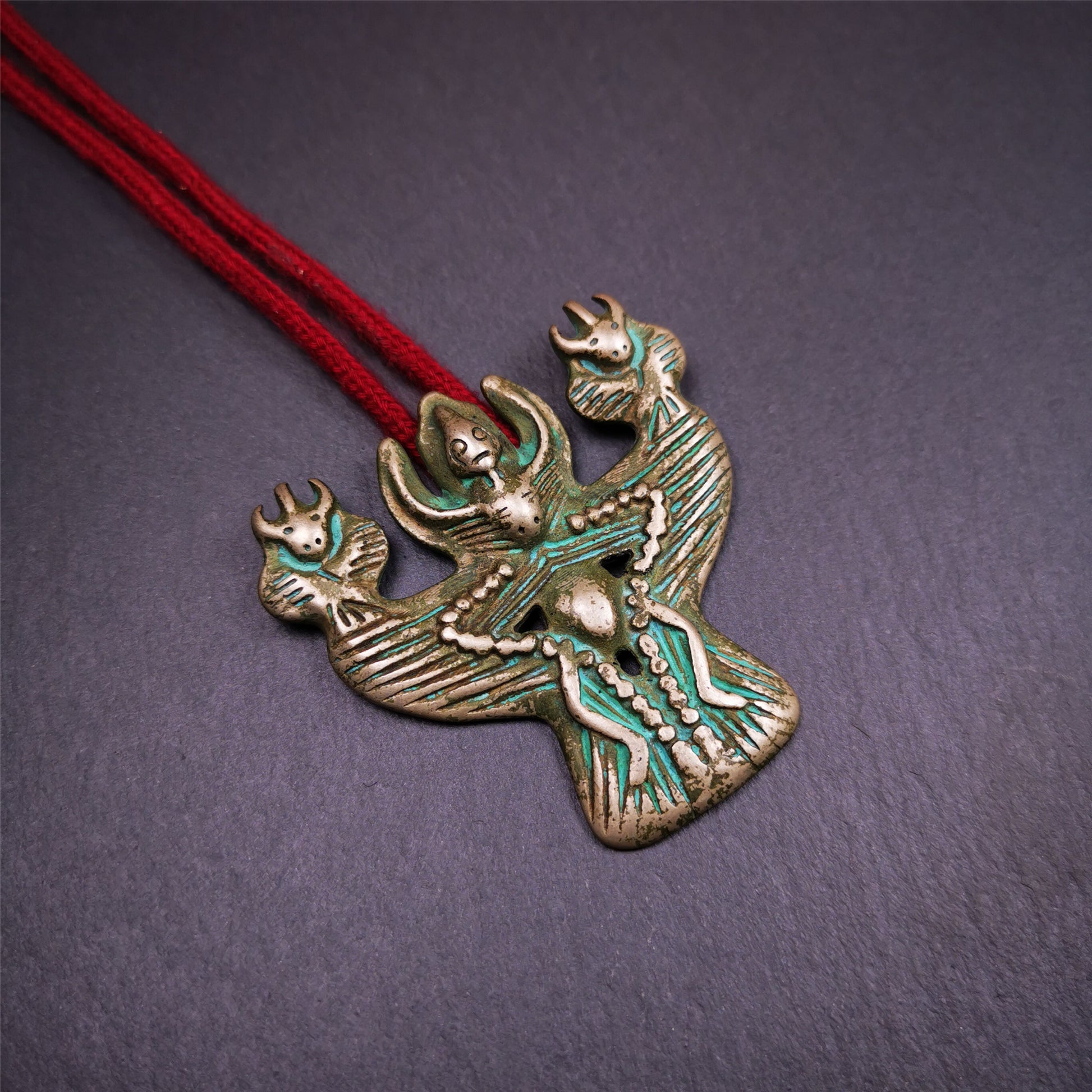 This Garuda is collected from Yaqing Monastery Baiyu County Tibet,it's a handmade badge,amulet pandent, made of copper,about 80 years old.  You can wear it as amulet pendant, or make it into wall decoration, hang on the door as a protector,or just put it on your desk,as an ornament.