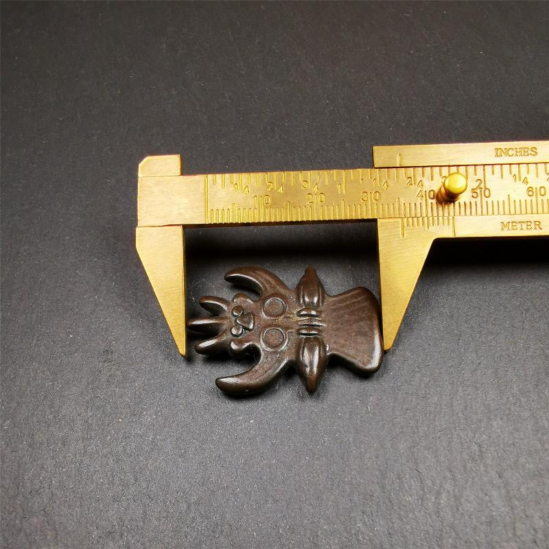 Garuda Amulet - 1.38" - Tibetan Buddhist amulet, size reference