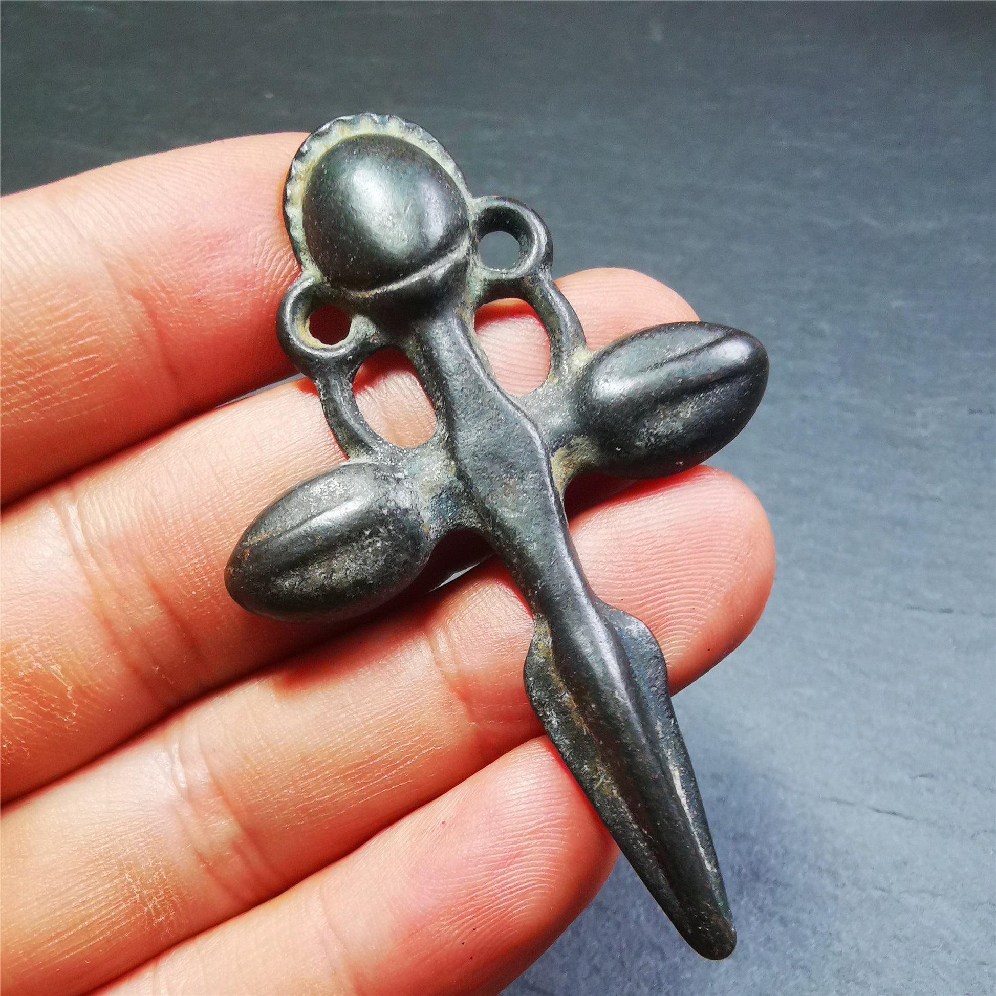This beautiful phurba pendant is hand carved by Tibetan craftsmen from Tibet in 1960's. It is made of thokcha,full of black color,the upper part is a horizontal vajra, and the lower part is a phurba,size is 2.6 by 1.7 inches