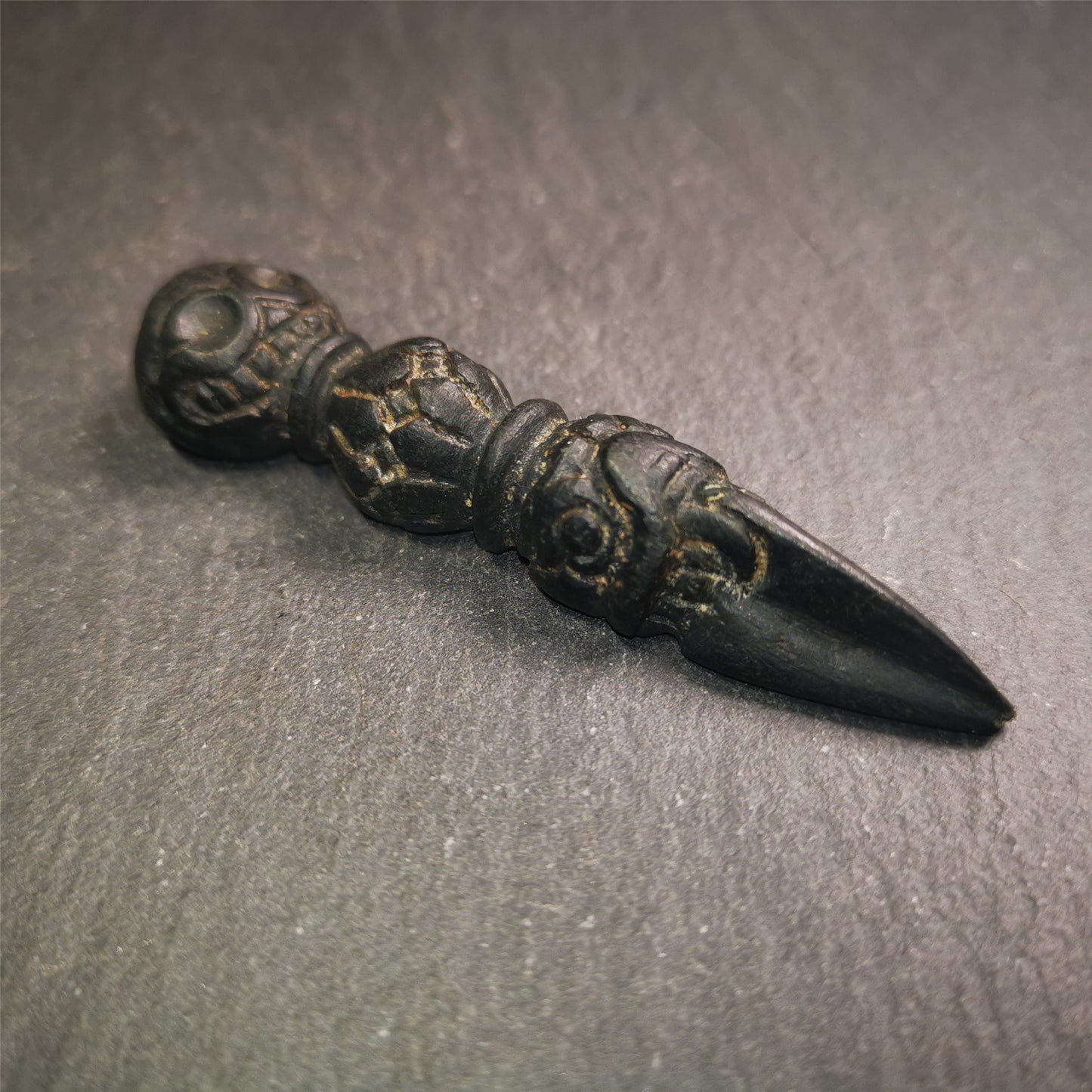 Gandhanra Unique Tibetan Buddhist Ritual Implement - Kila -Dorje Phurba,it was hand carved of natural Obsidian,total 2.83" inches.The top is Shmashana Adhipati skull shape, the middle is half vajra and the bottom is phurba