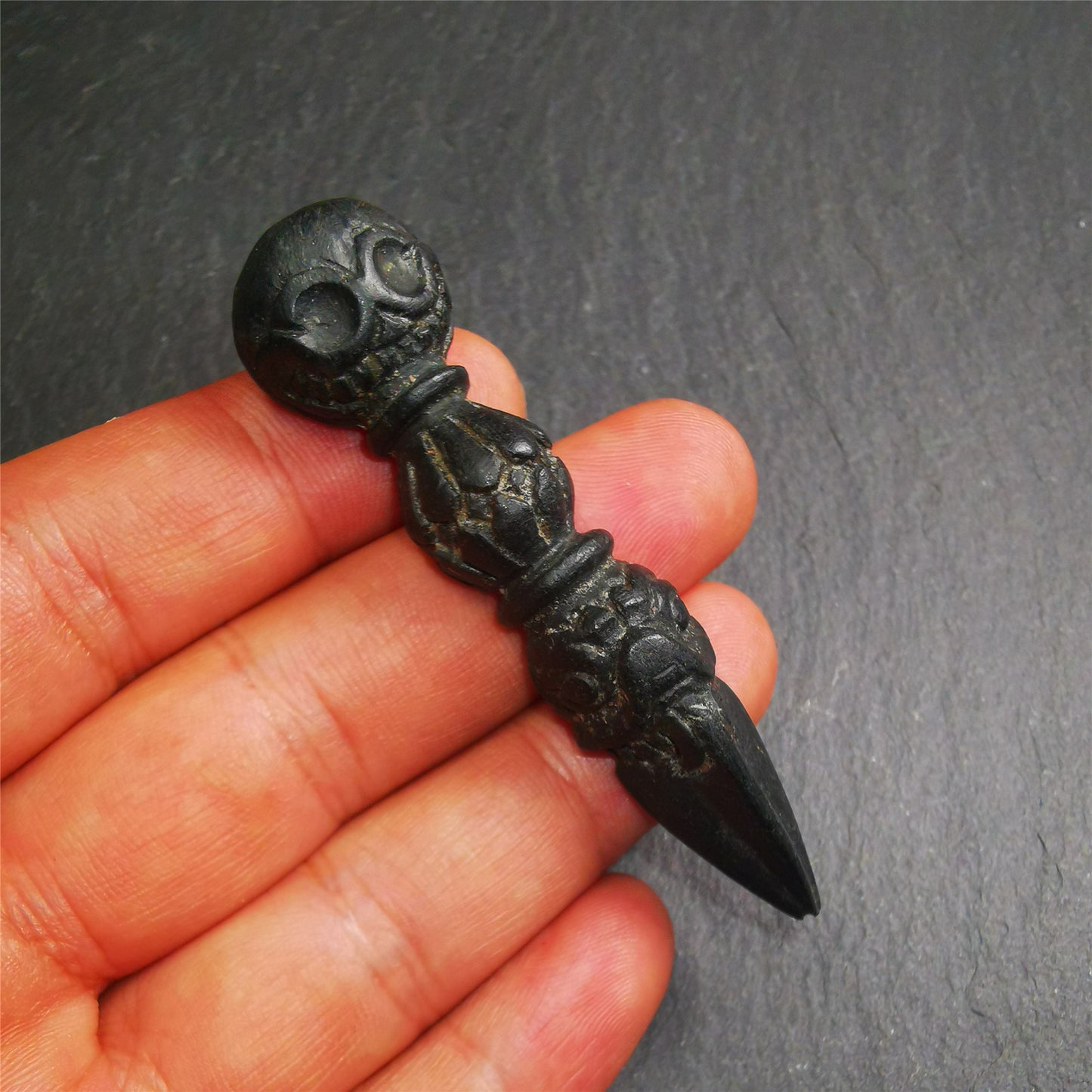 Gandhanra Unique Tibetan Buddhist Ritual Implement - Kila -Dorje Phurba,it was hand carved of natural Obsidian,total 2.83" inches.The top is Shmashana Adhipati skull shape, the middle is half vajra and the bottom is phurba