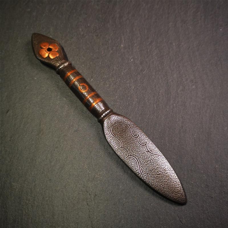 This kila / phurba was handmade by Tibetan craftsmen from Tibet in 2000s.  It's a kila dagger,made of cold iron, carved cloud pattern, inlaid red copper, made into a dzi pattern on handle, and the petals of the tail hanging ring