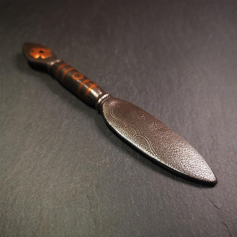 This kila / phurba was handmade by Tibetan craftsmen from Tibet in 2000s.  It's a kila dagger,made of cold iron, carved cloud pattern, inlaid red copper, made into a dzi pattern on handle, and the petals of the tail hanging ring