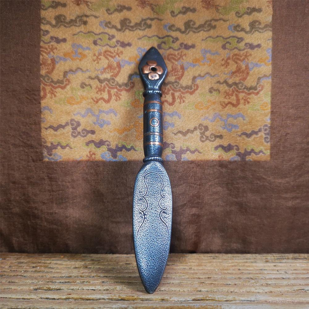 This kila / phurba was handmade by Tibetan craftsmen from Tibet in 2000s.  It's a kila dagger,made of cold iron, carved cloud pattern, inlaid red copper, made into a dzi pattern on handle, and the petals of the tail hanging ring