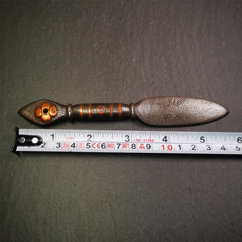 This kila / phurba was handmade by Tibetan craftsmen from Tibet in 2000s.  It's a kila dagger,made of cold iron, carved cloud pattern, inlaid red copper, made into a dzi pattern on handle, and the petals of the tail hanging ring