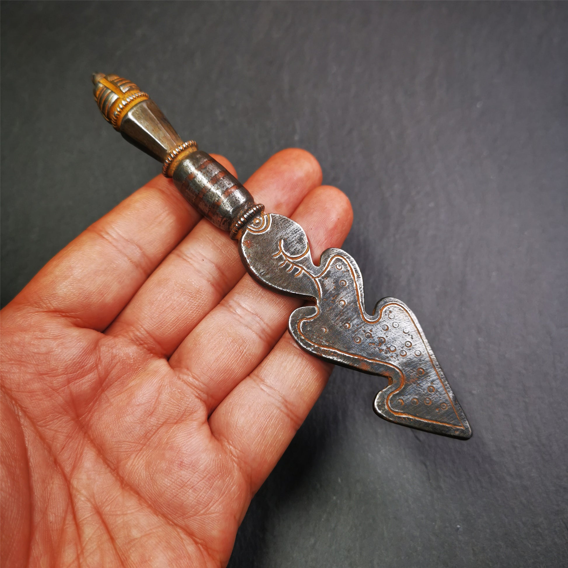 This phurba kila was handmade by Tibetan craftsmen from Tibet in 1990s,from Hepo Town, Baiyu County.  It&#39;s a Snake Spear,made of cold iron, carved cloud pattern, inlaid red copper, made into 3line on handle, and the pagoda at the tail.