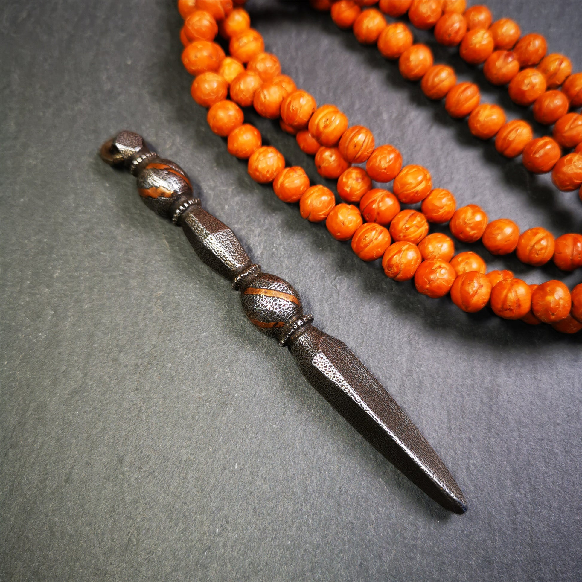 This handmade Dorje Phurba was crafted by Tibetan craftsmen from Hepo Town, Baiyu County, Tibet,known for its renowned Tibetan handicrafts. The upper part is a vajra, and the lower part is a phurba. A copper wire is inlaid on the waist of the phurba