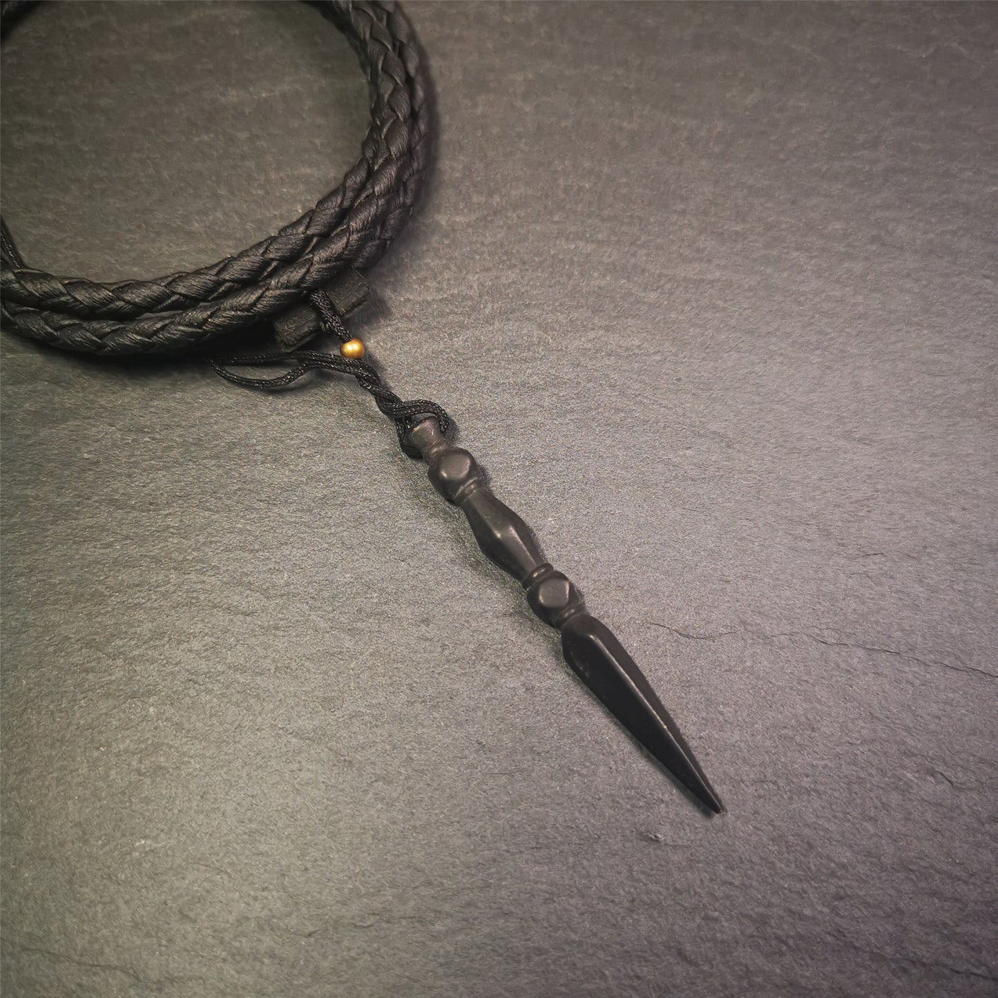 This handmade Dorje Phurba was crafted by Tibetan craftsmen from Hepo Town, Baiyu County, Tibet. The length is 2.2 inches,black color,the upper part is a vajra, and the lower part is a phurba.