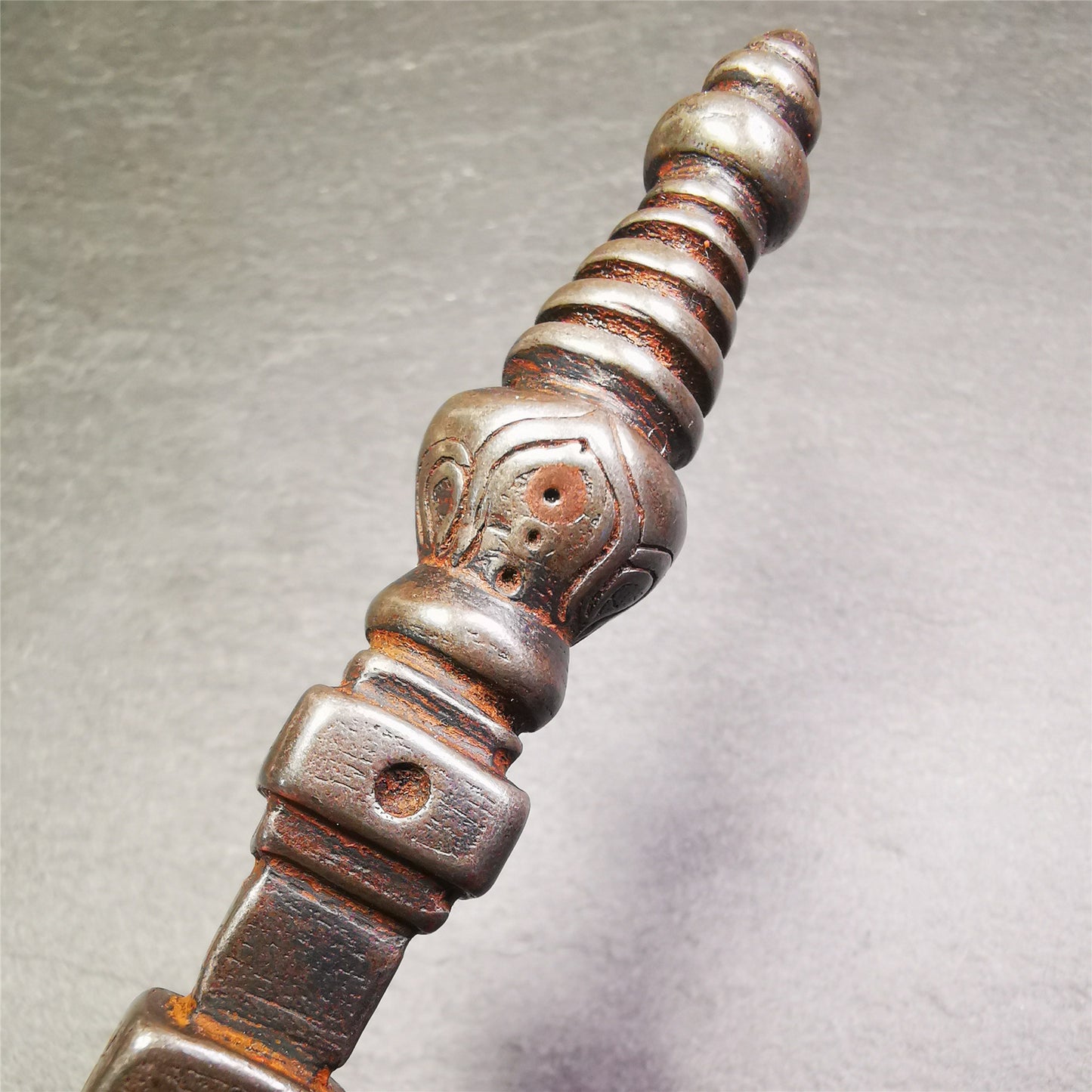 Gandhanra Tibetan Buddhist Ritual Implement - Kila -Dorje Phurba,Made of Cold Iron inlaid Copper,7.5".Its top is a stupa, in the middle is the skull Shmashana Adhipati, and at the bottom is a phurba,handmade by Tibetan craftsmen in 1990's.